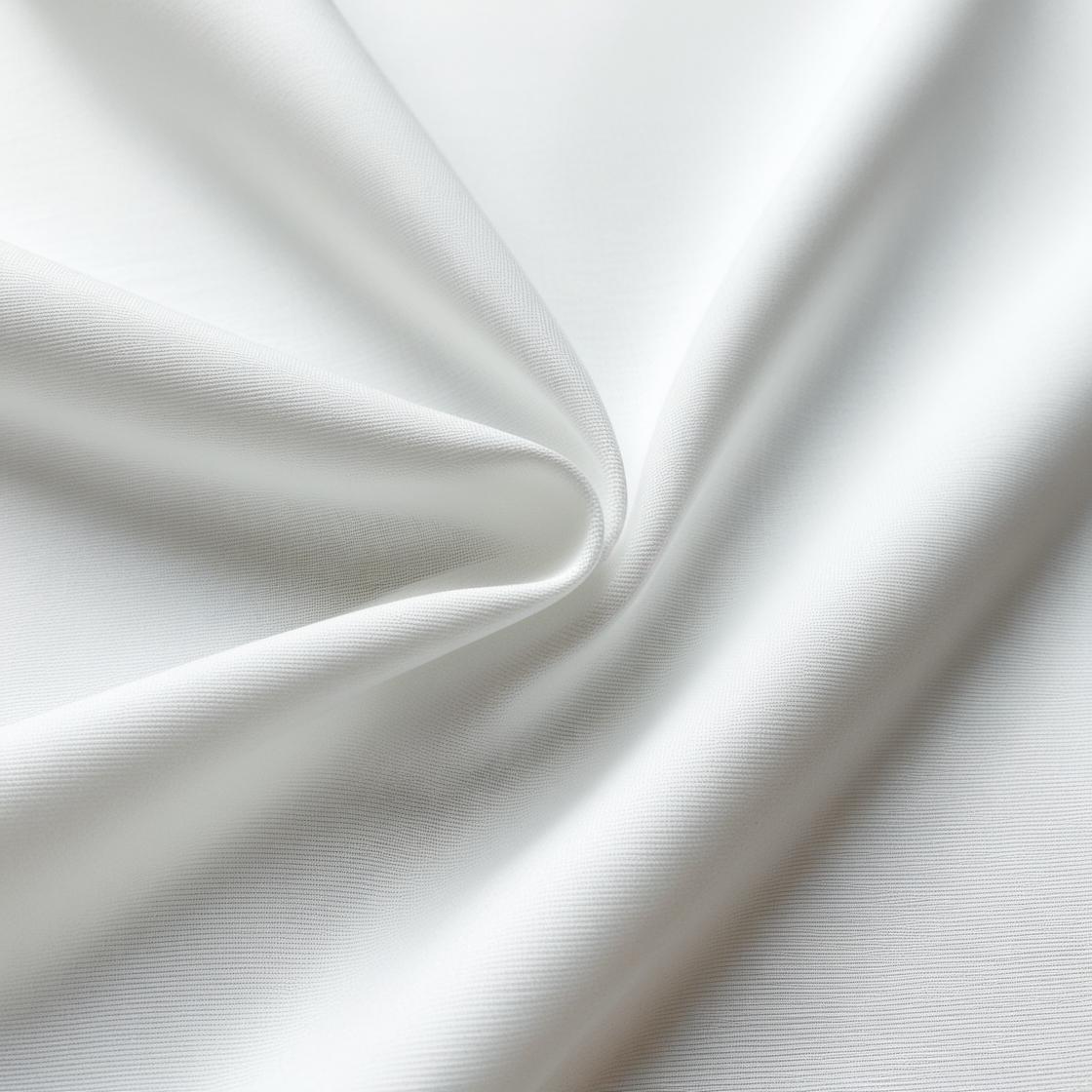 close up of white poly poplin fabric showing smooth texture and structured drape